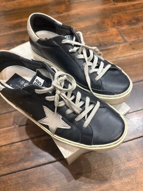 Black Leather Low-Top Sneakers with Star Accent